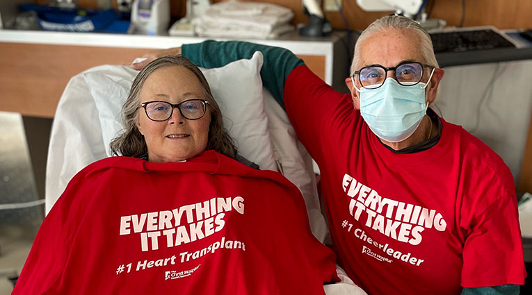 Terri Cecere and her husband George wearing red Everything It Takes First Heart Transplant shirts