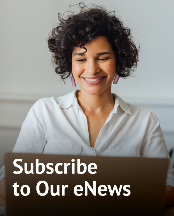 Woman on Laptop with text overlay to Subscribe to Our eNews