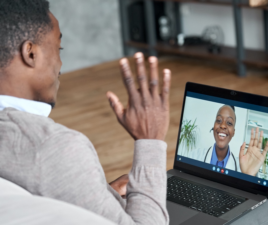 African American man on telehealth call with doctor.